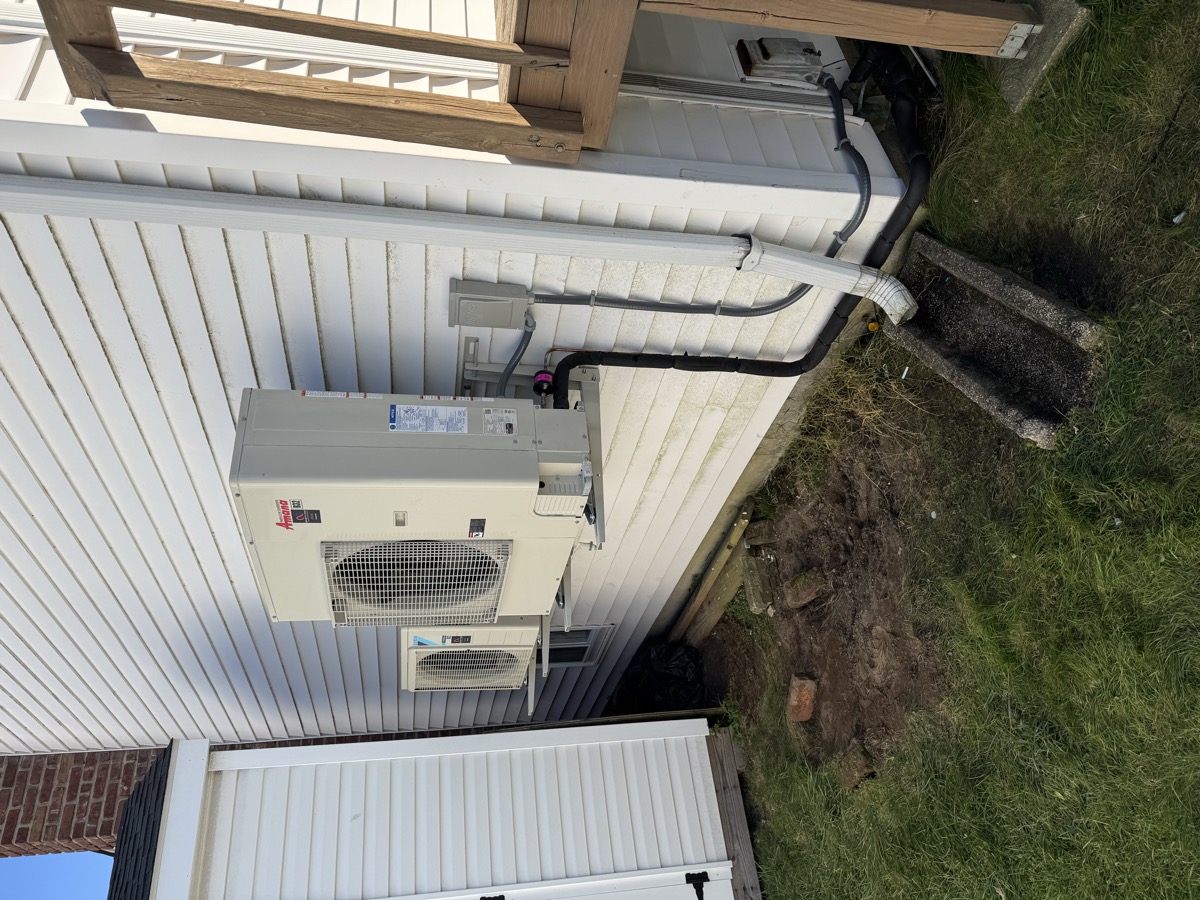 Technician repairing an AC unit